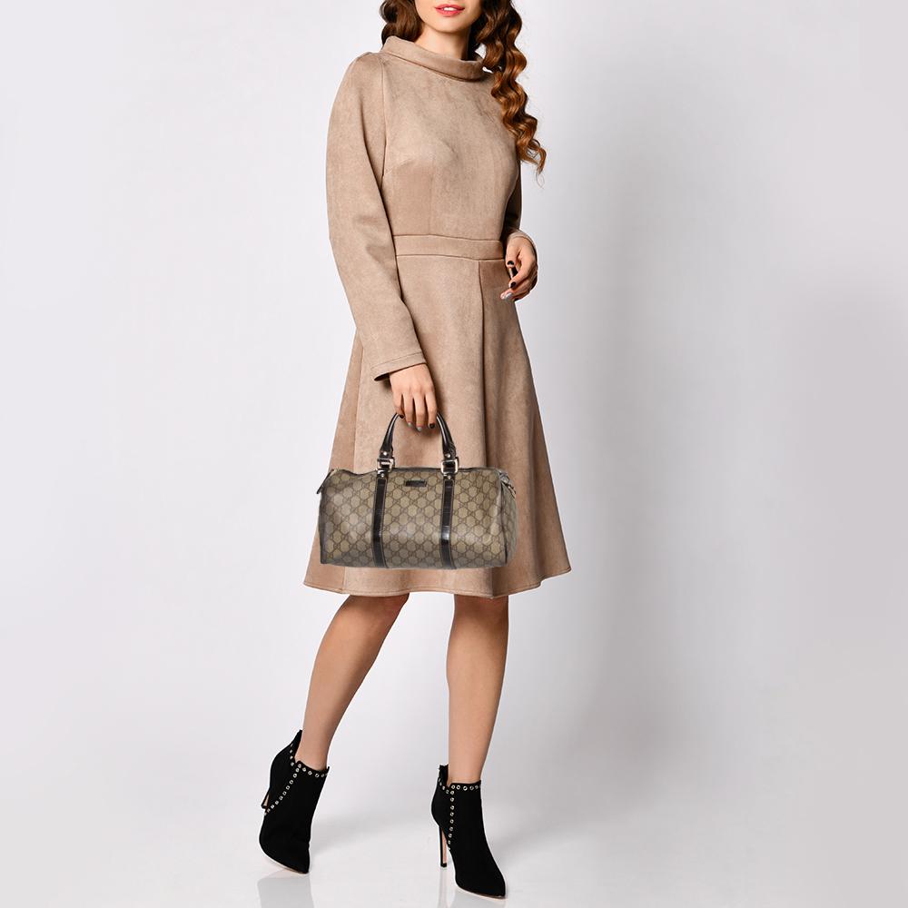This handbag from the house of Gucci will reflect your fabulous choices. This Joy Boston bag is stylish and an absolute must-have. Crafted in Italy from GG Supreme coated canvas, it comes in a beige hue and is adorned with brown patent leather