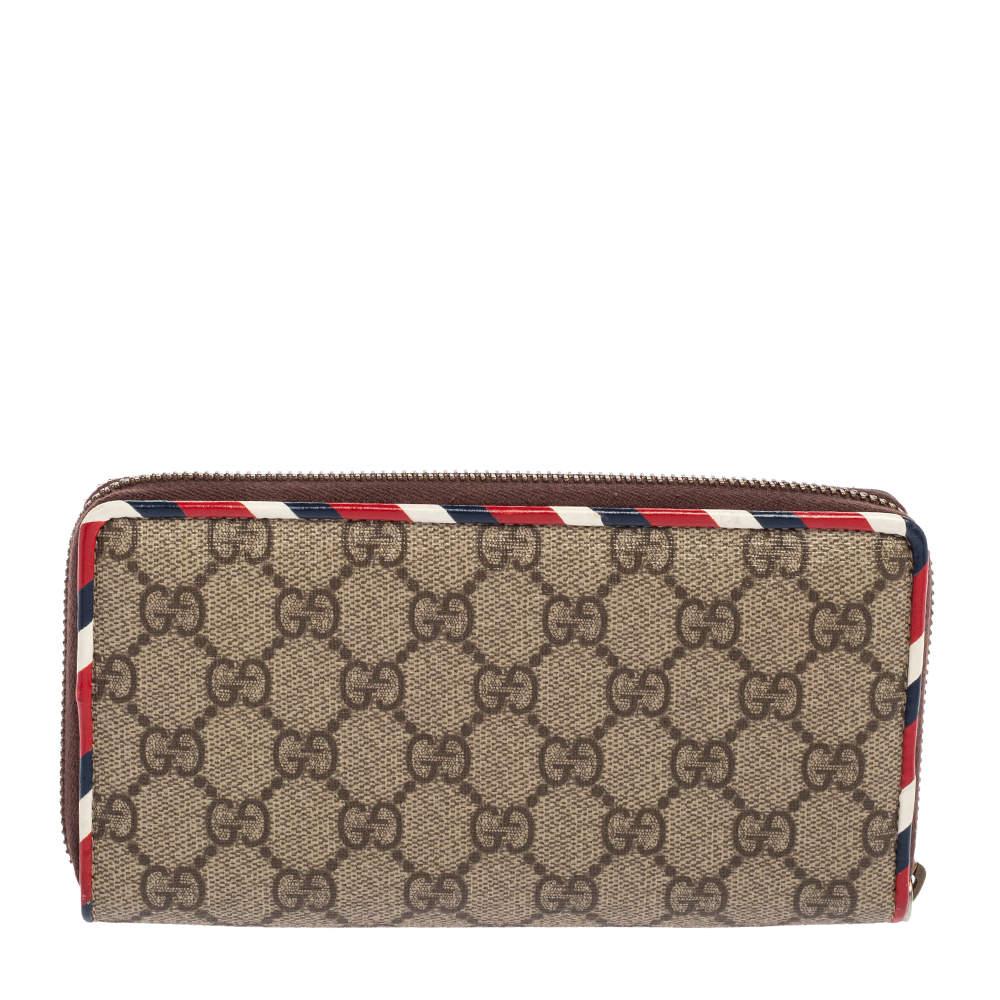 Carry your essential items in style in this Gucci zip-around wallet. Made from coated canvas and leather, the wallet features eye-catching, colorful patches on the front and is complete with multiple slots in the interior.

Includes: w/patches

