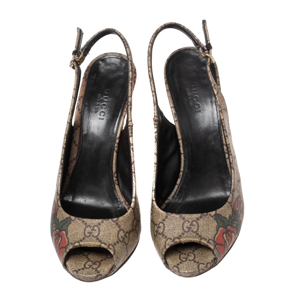 Presented by the House of Gucci, these gorgeous pumps are designed with selective features to offer elegance and poise. They are made from beige-brown GG Supreme canvas. They have a buckled slingback, peep-toes, and slender heels. Exude charm by
