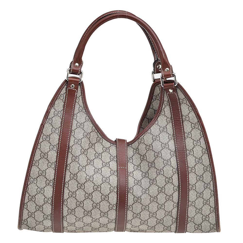 A handbag should not only be good-looking but also durable, just like this pretty Jackie O hobo from Gucci. Crafted in Italy and made from the brand's GG Supreme canvas and leather, this gorgeous hobo comes in subtle shades of beige and brown. This