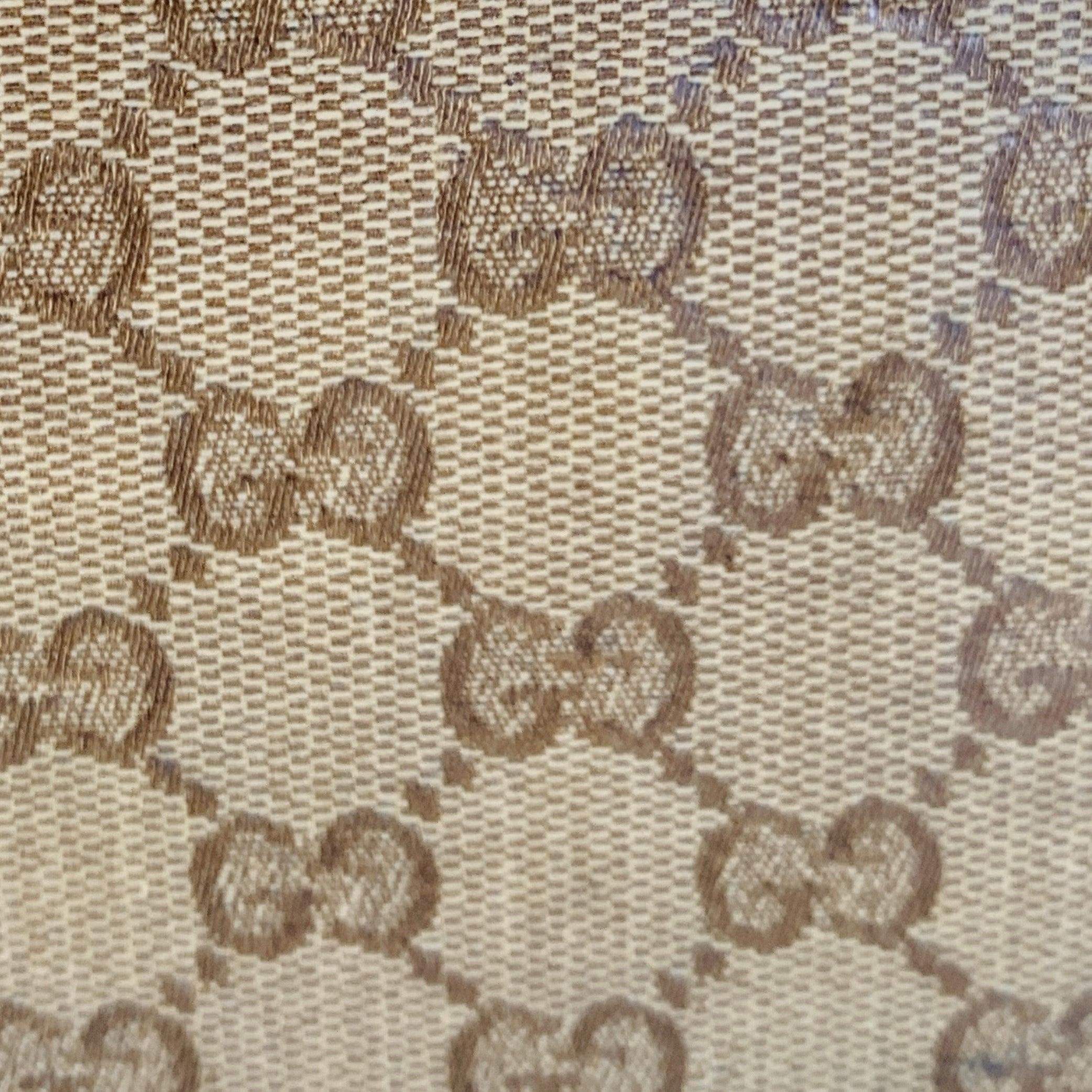 Vintage GUCCI suitcase
in a beige and brown coated canvas featuring signature Guccissima pattern, brown leather edges, and zip closure. Made in Italy. Note: this item comes with a lock but no key, which does not impede use of the suitcase at