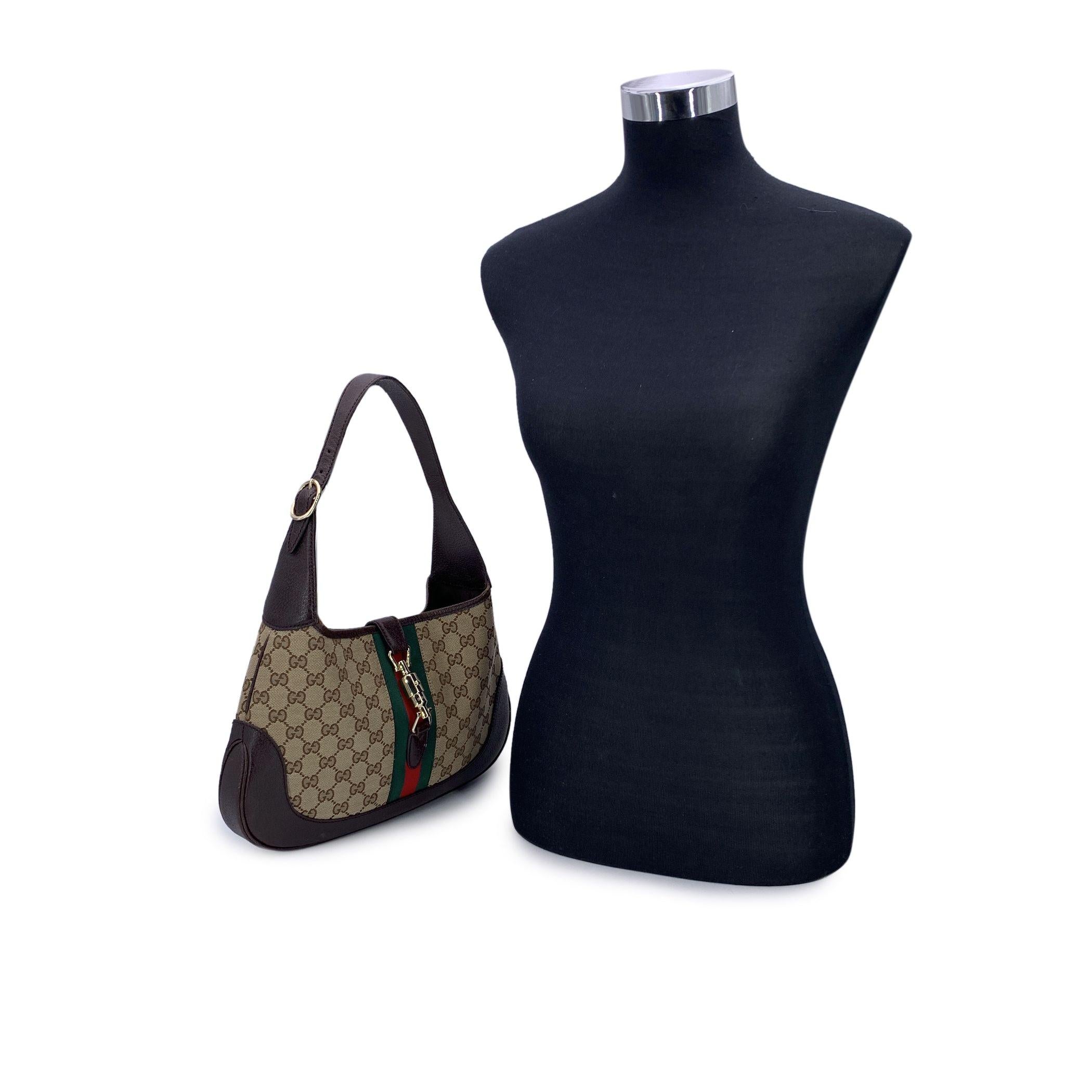 This beautiful Bag will come with a Certificate of Authenticity provided by Entrupy. The certificate will be provided at no further cost. Step into a piece of luxury history with the Gucci 'Jackie 1961' Hobo Bag, a timeless creation that channels