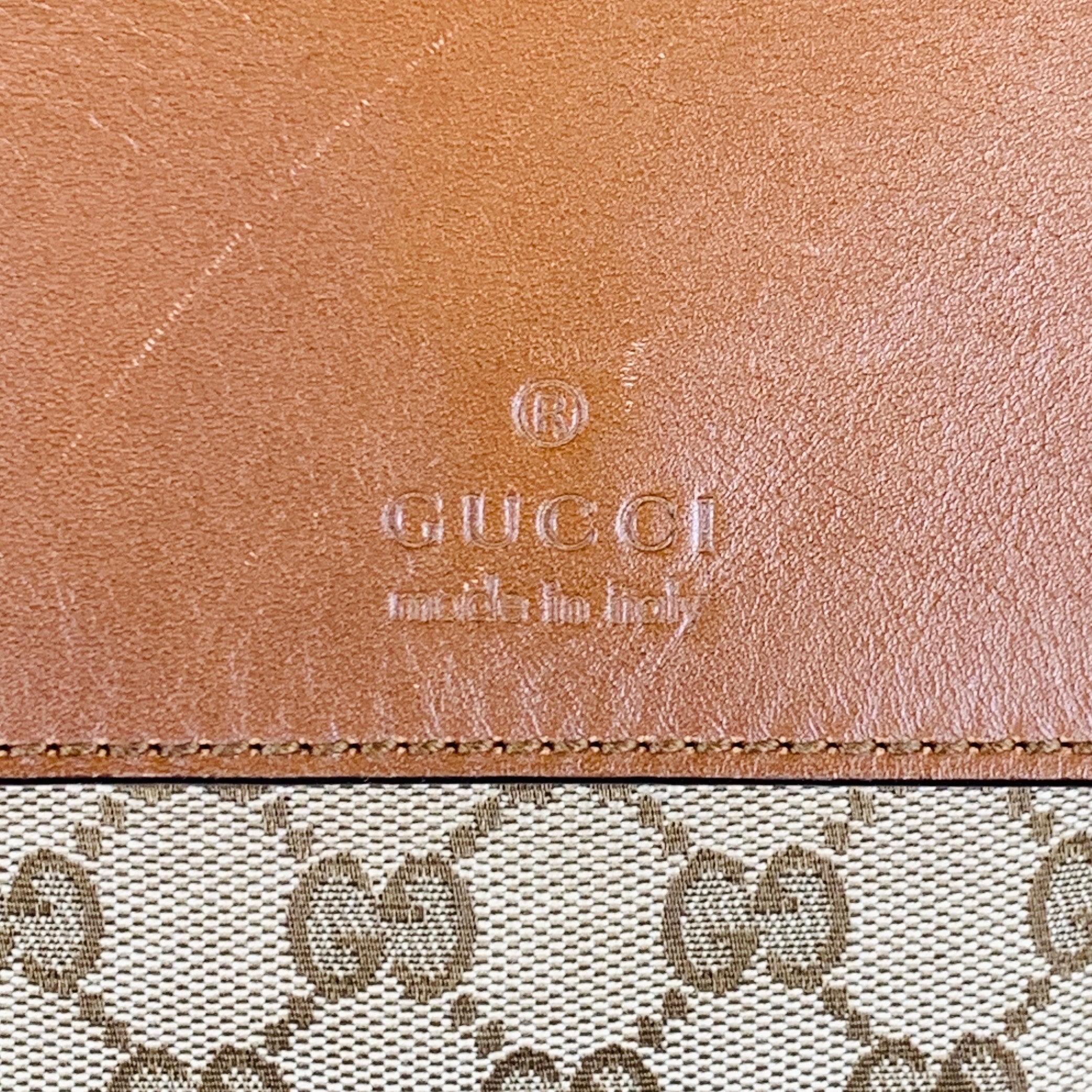 GUCCI crossbody bag
in a beige and brown canvas featuring interlocking GG monogram logo pattern, brown leather flap and trim, and snap closure. Comes with dust bag. Made in Italy.Very Good Pre-Owned Condition. Minor signs of wear. 

Marked:   322077