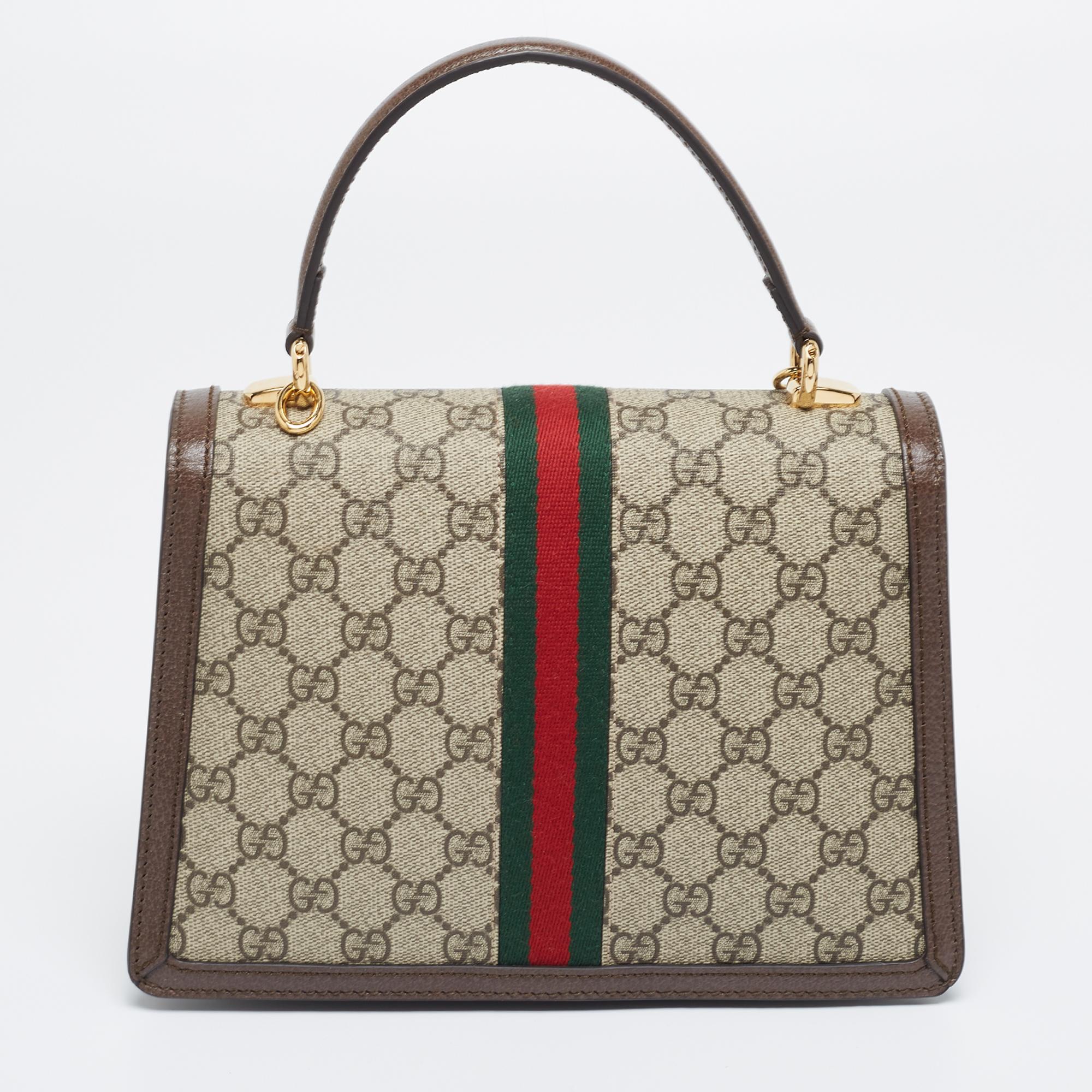 You will enjoy parading this fabulous bag from Gucci. It comes made from GG Supreme canvas and leather and features a single top handle and a detachable strap. It is equipped with a capacious interior meant to hold all your daily essentials with