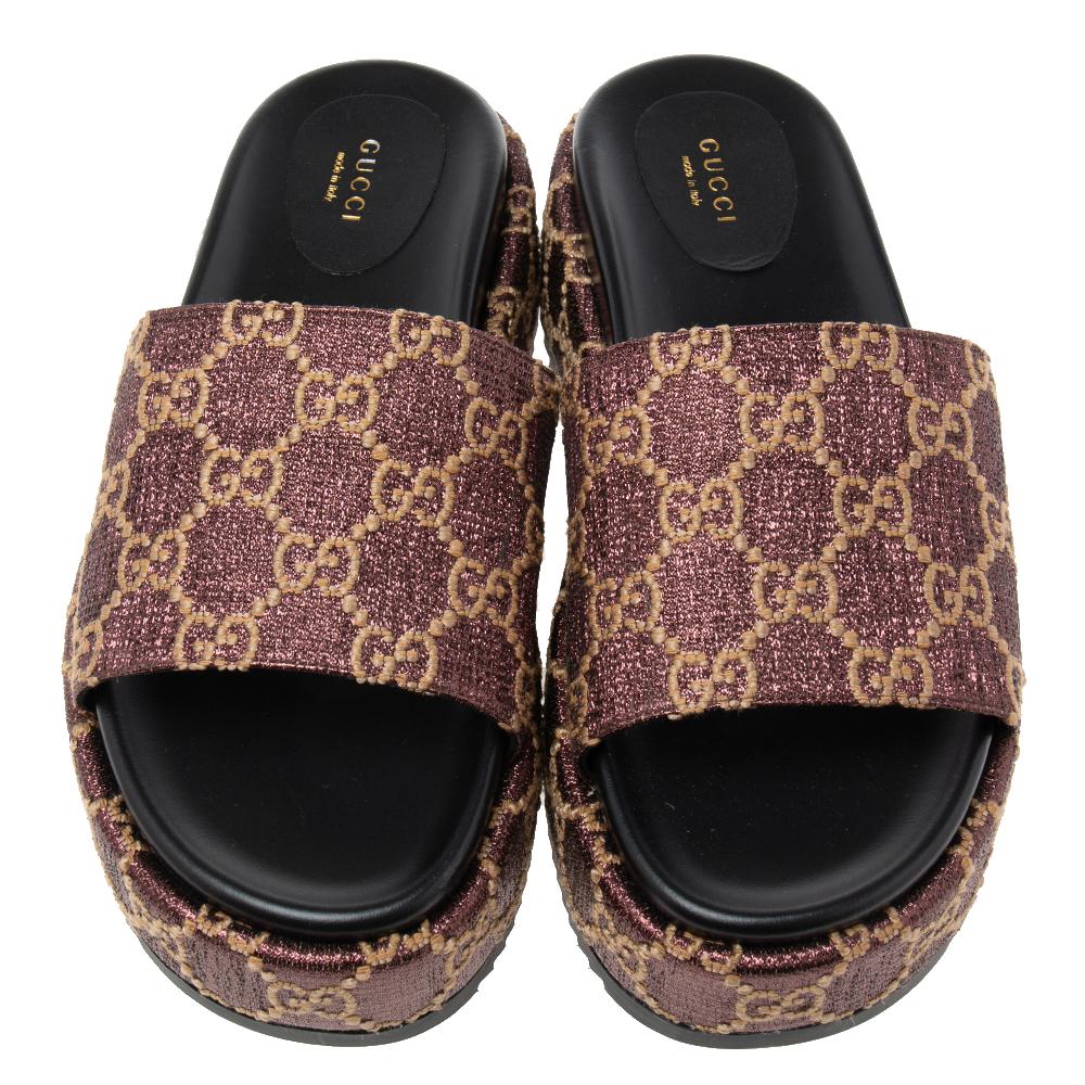 Look your absolute best this summer with these slide sandals from the House of Gucci. They are made from beige-burgundy GG lurex fabric and feature platforms. They have a slip-on style.

Includes: Original Dustbag
