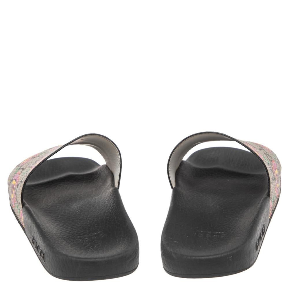 Comfort and style come together to create these Gucci flat slides. Crafted from GG Supreme canvas, the broad straps are adorned with butterfly prints.

Includes: Original Dustbag