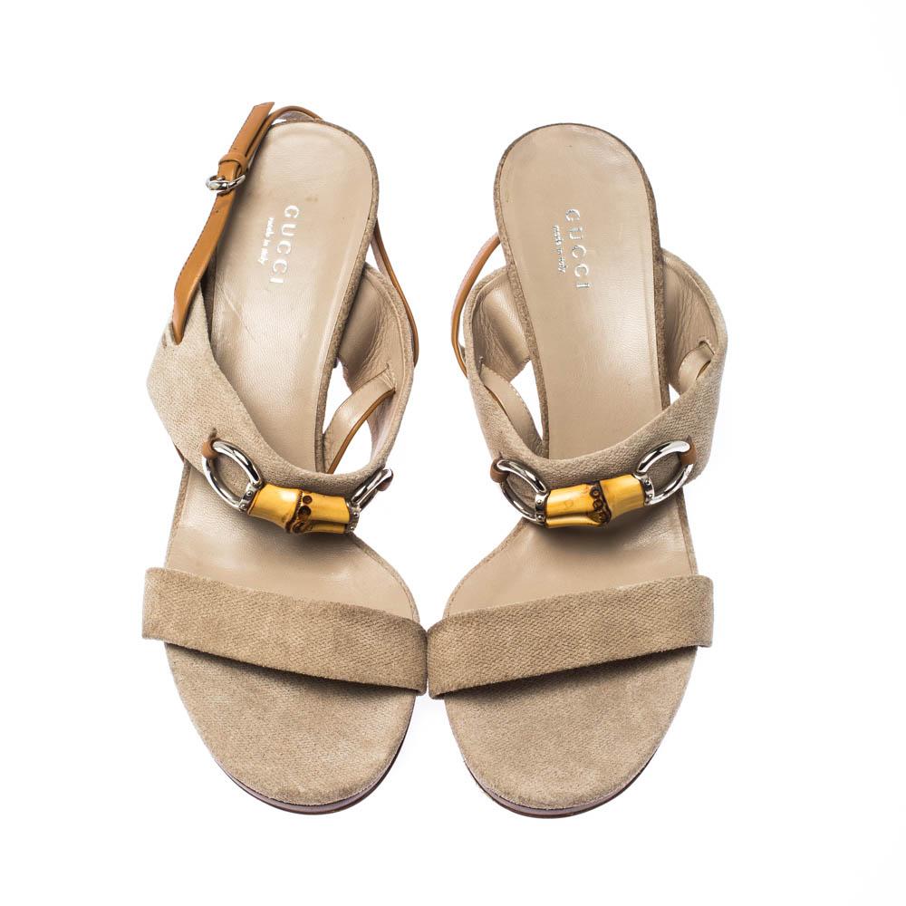 Slip into these Gucci sandals and add grace to your strides. Crafted from beige canvas, these slingbacks feature bamboo Horsebit details. With open toes and 9 cm heels, these sandals will give a feel of luxury to your feet.

Includes: The Luxury