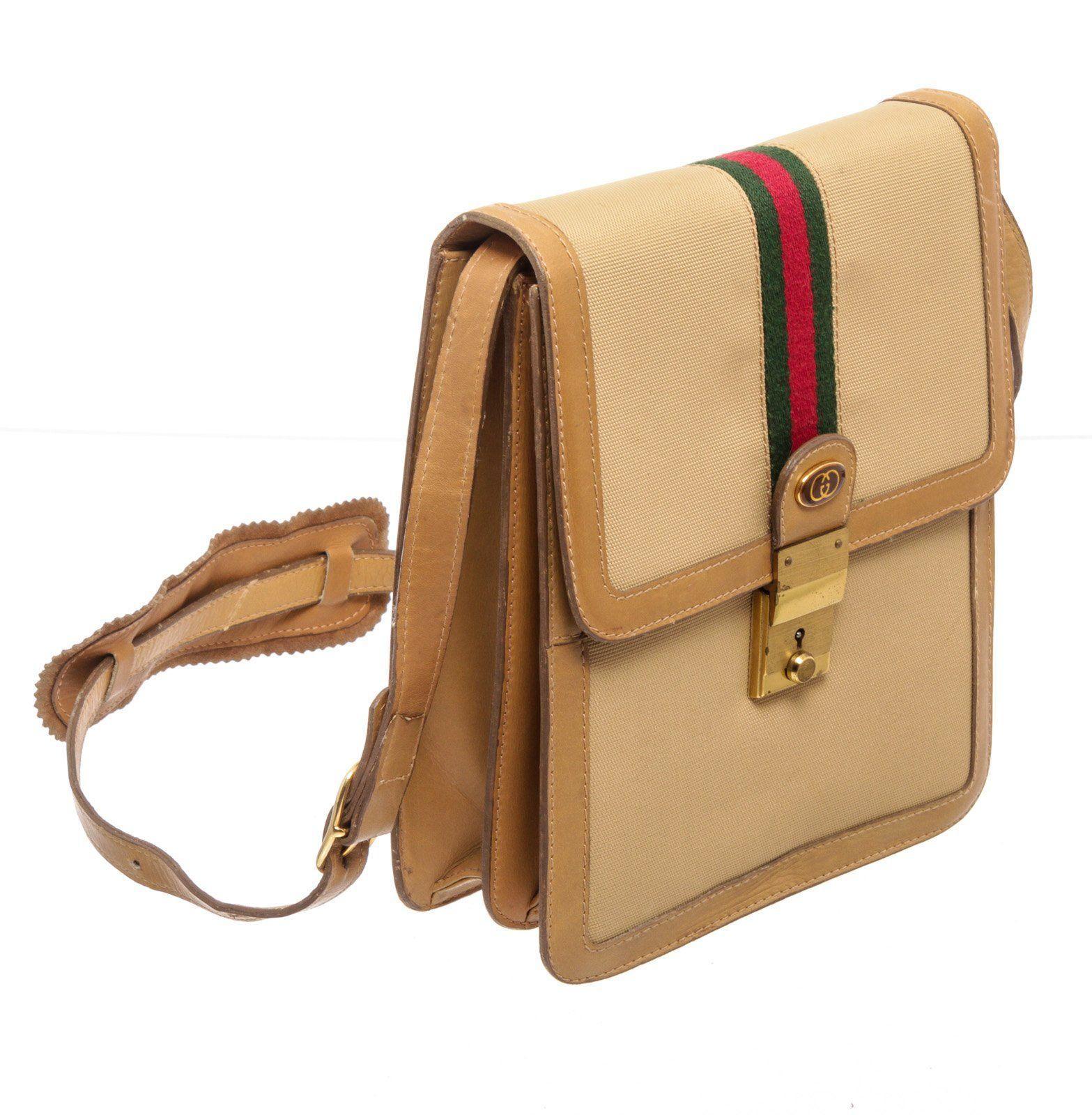 Gucci Beige Canvas Sherry Shoulder Bag with gold-tone hardware, beige leather trim, leather shoulder strap, and flap closure.


27308MSC