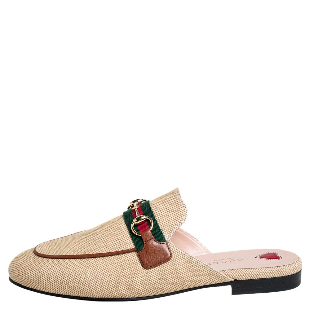 These Gucci Princetown mules are a fresh update on the perennially chic Gucci loafers. These shoes are enhanced by a gold-tone Horsebit detail atop Web stripes that have defined the Gucci collection since the very beginning. Featuring a canvas body,