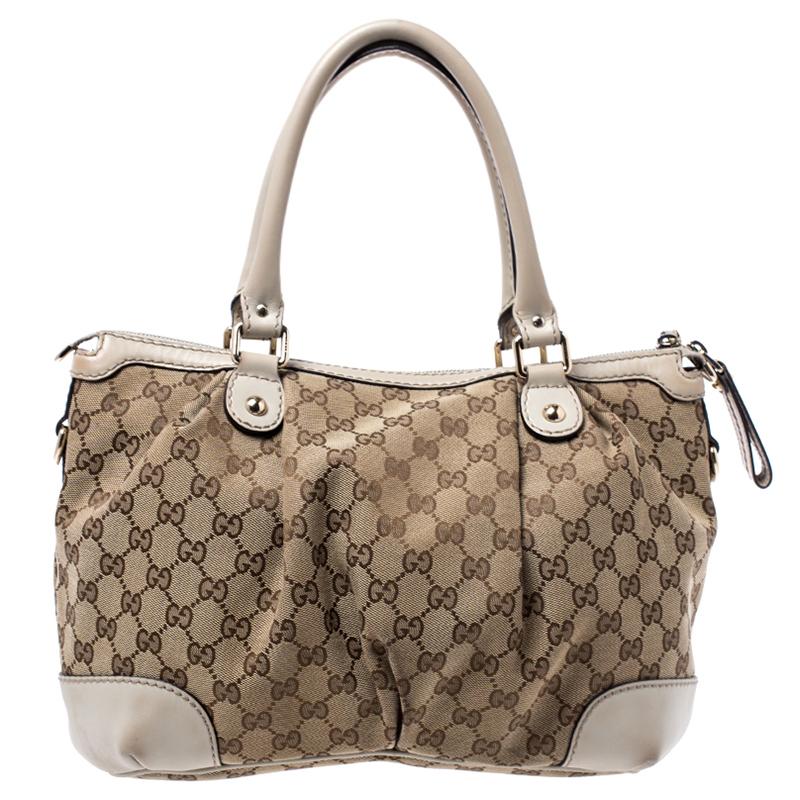 The Sukey is one of the best-selling designs from Gucci and we believe you deserve to have one too. Crafted from beige GG coated canvas as well as cream leather trims and equipped with a spacious fabric-lined interior, this bag is ideal for you and