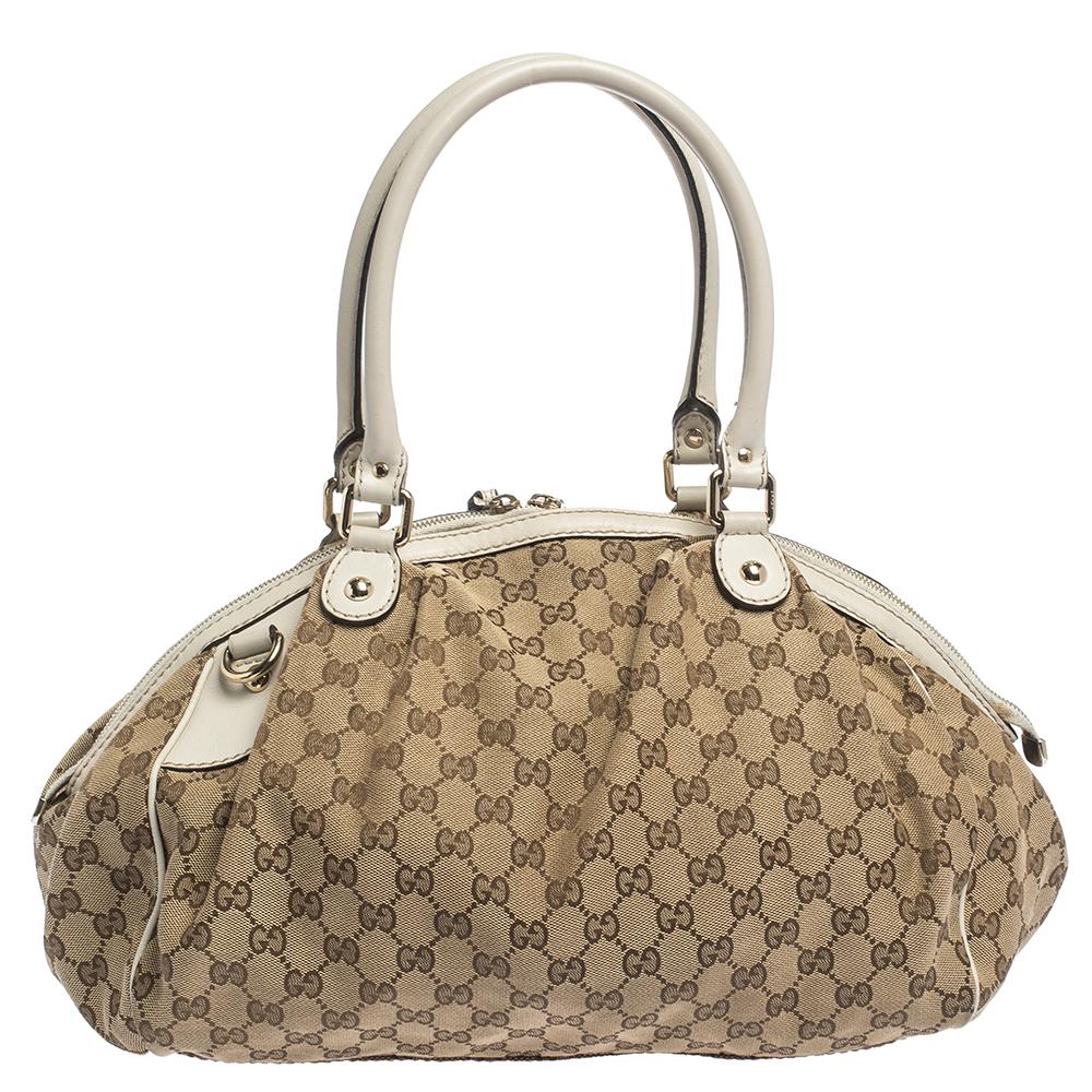 The Sukey is one of the best-selling designs from Gucci and we believe you deserve to have one too. Crafted from GG canvas and leather and equipped with a spacious interior, this beige & cream bag is ideal for you and will work perfectly with any