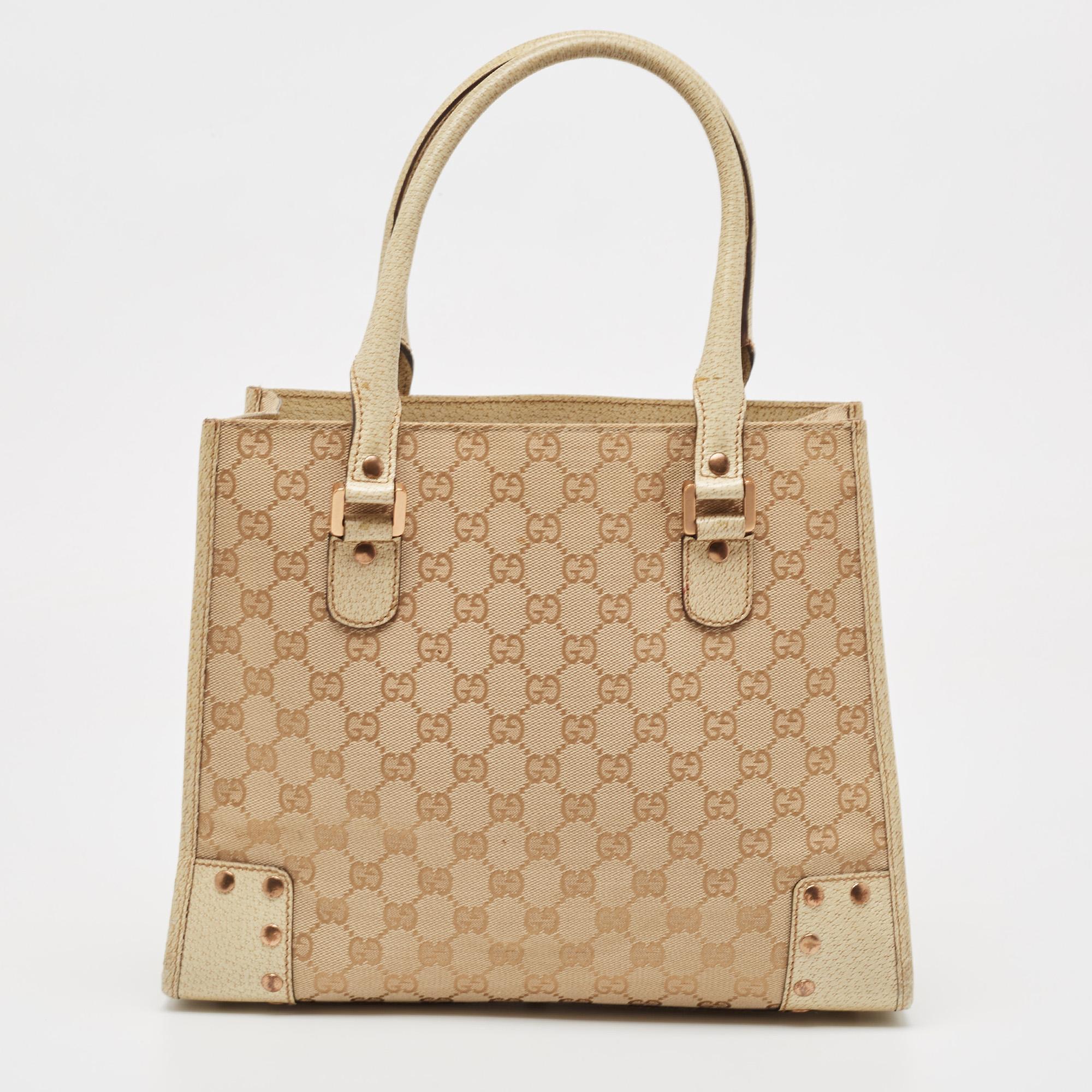 Indulge in luxury with this Gucci GG canvas bag. Meticulously crafted from premium materials, it combines exquisite design, impeccable craftsmanship, and timeless elegance. Elevate your style with this fashion accessory.

Includes: Original Dustbag

