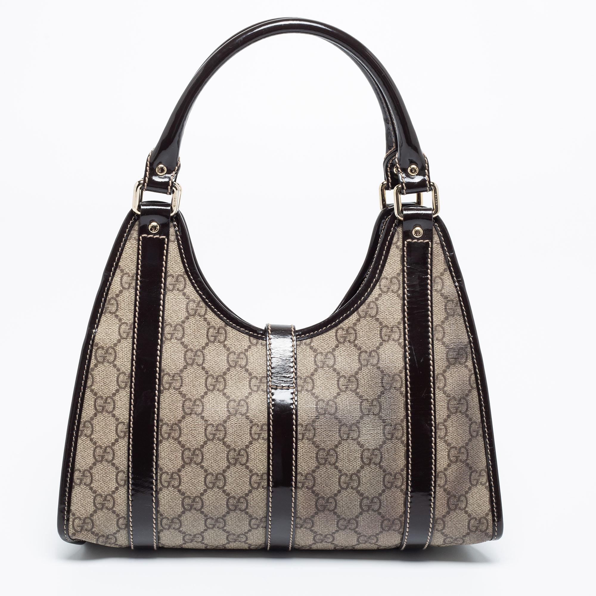 Simple details, high quality, and everyday convenience mark this Joy hobo by Gucci. The bag is made of GG Supreme canvas as well as leather and it features dual handles, gold-tone metal accents, and a spacious interior.

Includes: Info Booklet
