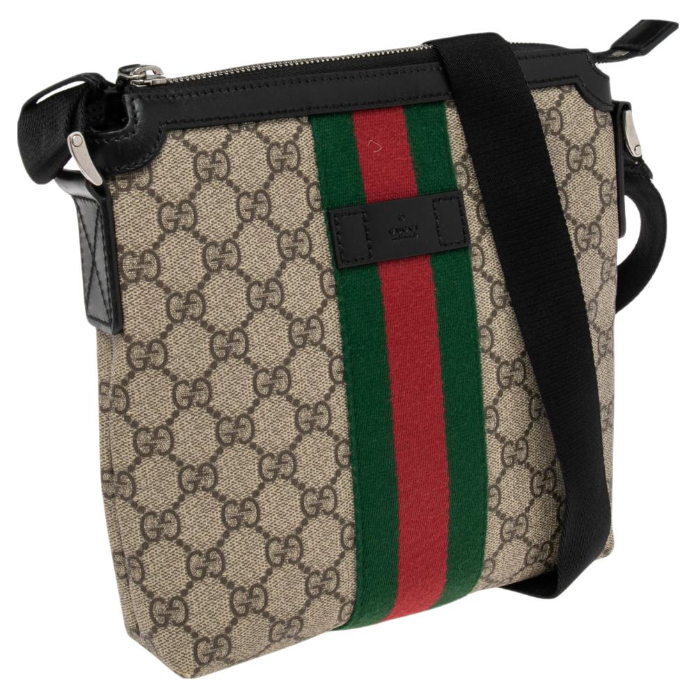 Designed expertly using the beige-ebony GG Supreme canvas with the Web strap in the middle, this messenger bag from Gucci gives you a signature appearance. The interior of this bag is lined with nylon and is occupied with ample space to store your