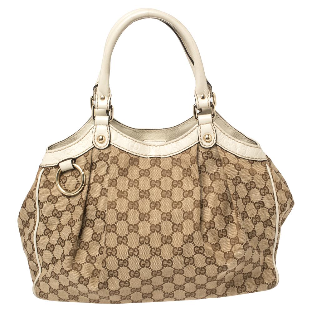 The Sukey is one of the best-selling designs from Gucci, and we believe you deserve to have one too. Crafted from GG canvas and leather in a beige hue and equipped with a spacious interior, this tote is ideal for you and will work perfectly with any