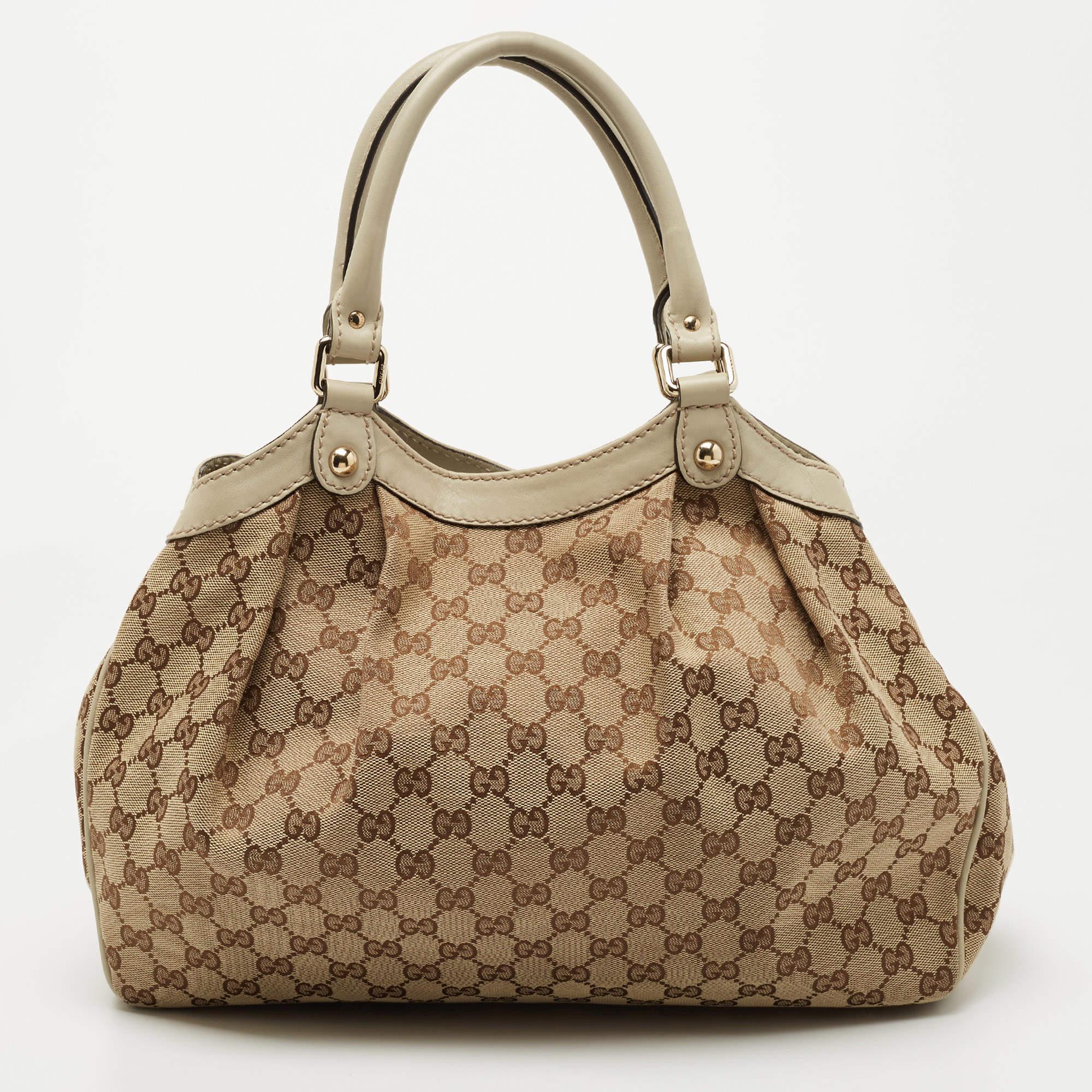 The Sukey is one of the best-selling designs from Gucci, and we believe you deserve to have one too. Crafted from GG canvas & leather and equipped with a spacious interior, this bag will work perfectly with any outfit. It is complete with two