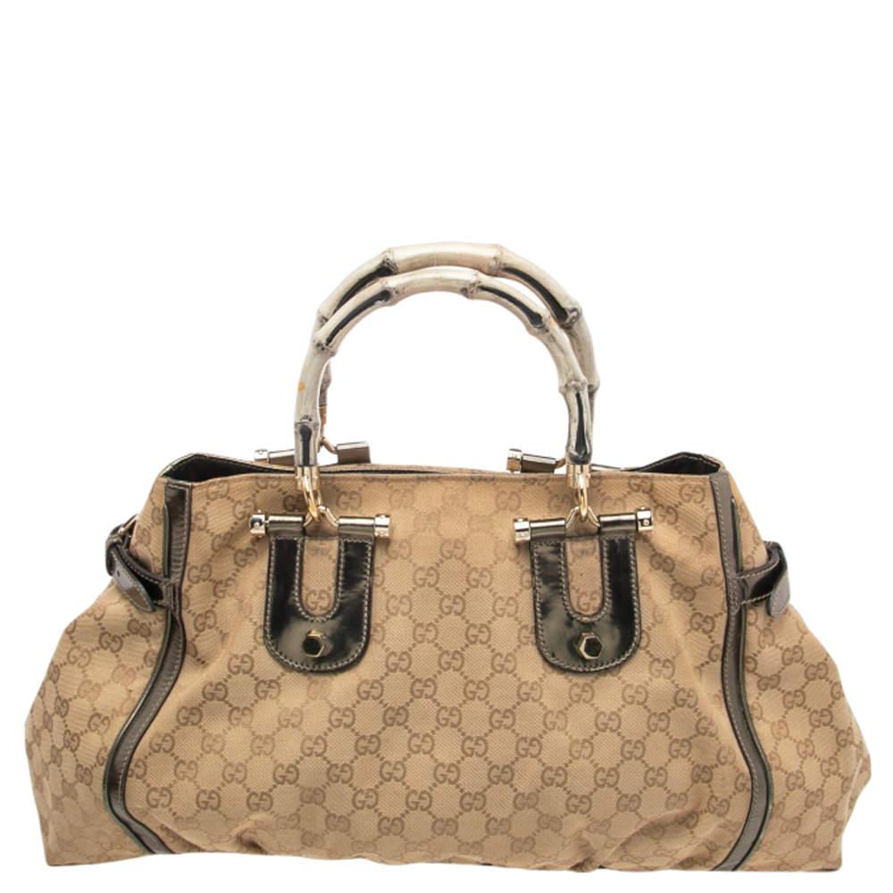 Handbags as fabulous as this one are impossible to miss! This tote from Gucci will certainly liven up your closet. It is crafted using beige GG canvas and patent leather on the exterior and flaunts a sturdy shape held by dual Bamboo handles. It