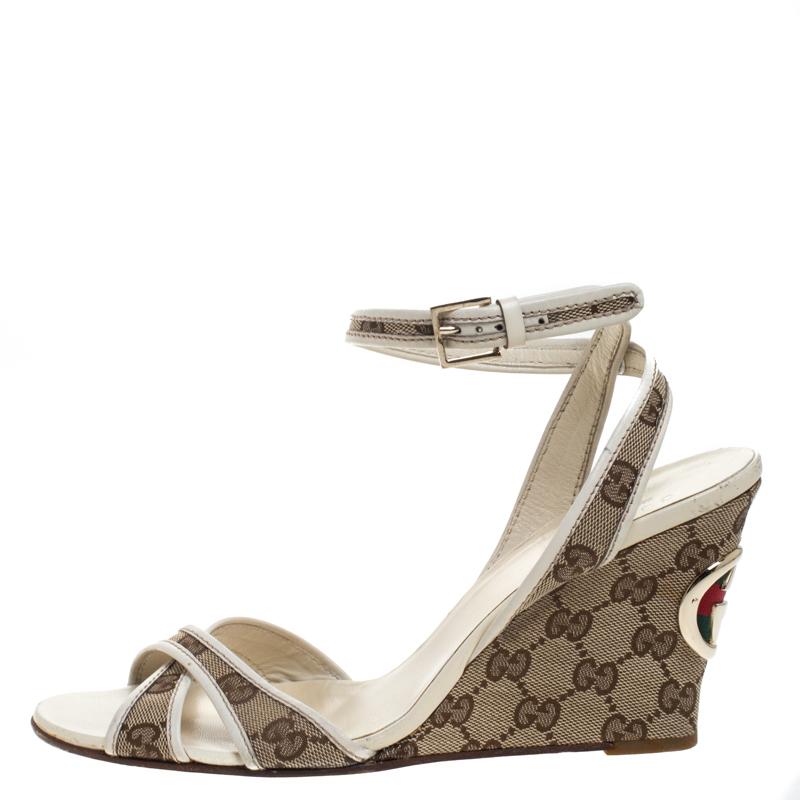A perfect blend of comfort and style, these GG canvas sandals are just what you need for a day out. The sandals are at their stylish best, set on wedges for an added flair. Wear these stylish sandals from the house of Gucci and channel your inner