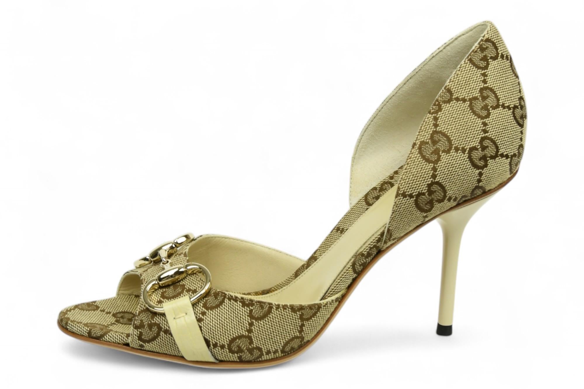 A timeless Gucci silhouette, these D’Orsay pumps are crafted from the house’s iconic beige GG monogram canvas and trimmed with smooth leather. The open-toe design is accented with gold-tone horsebit hardware for a signature equestrian touch.