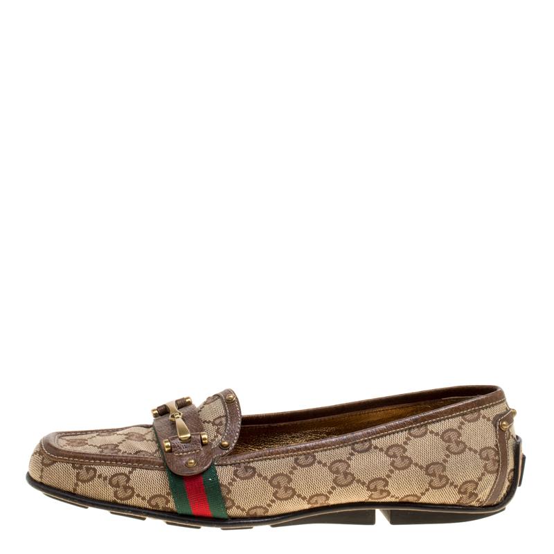 Stylish and well-crafted, these Gucci loafers are worth owning. They've been crafted from GG canvas and they come flaunting leather trims and Horsebit details and comfortable insoles. The loafers are ideal to be worn all day.

Includes: Original