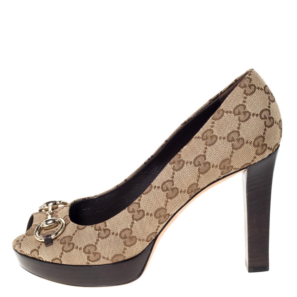 These pumps from Gucci are simple but a must-have. Crafted using GG canvas, and balanced on 11 cm heels as well as platforms, the peep-toe pumps are complete with the Horsebit accent on the uppers. They are high in both style and comfort.

