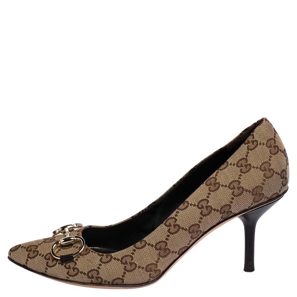 Gucci yet again brings a stunning set of pumps that makes us marvel at its beauty and craftsmanship. Crafted from GG canvas in a beige shade, they feature the Horsebit accents, pointed toes, and are raised on slender heels.

Includes: Original