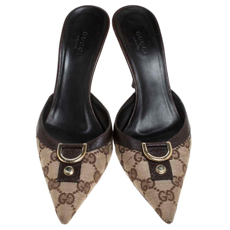 These lovely Gucci slide sandals will bring you the right amount of style and comfort. Crafted from GG coated canvas and leather, they feature uppers with gold-tone accents and 8 cm heels. They are gorgeous and easy to flaunt.

Includes: The Luxury