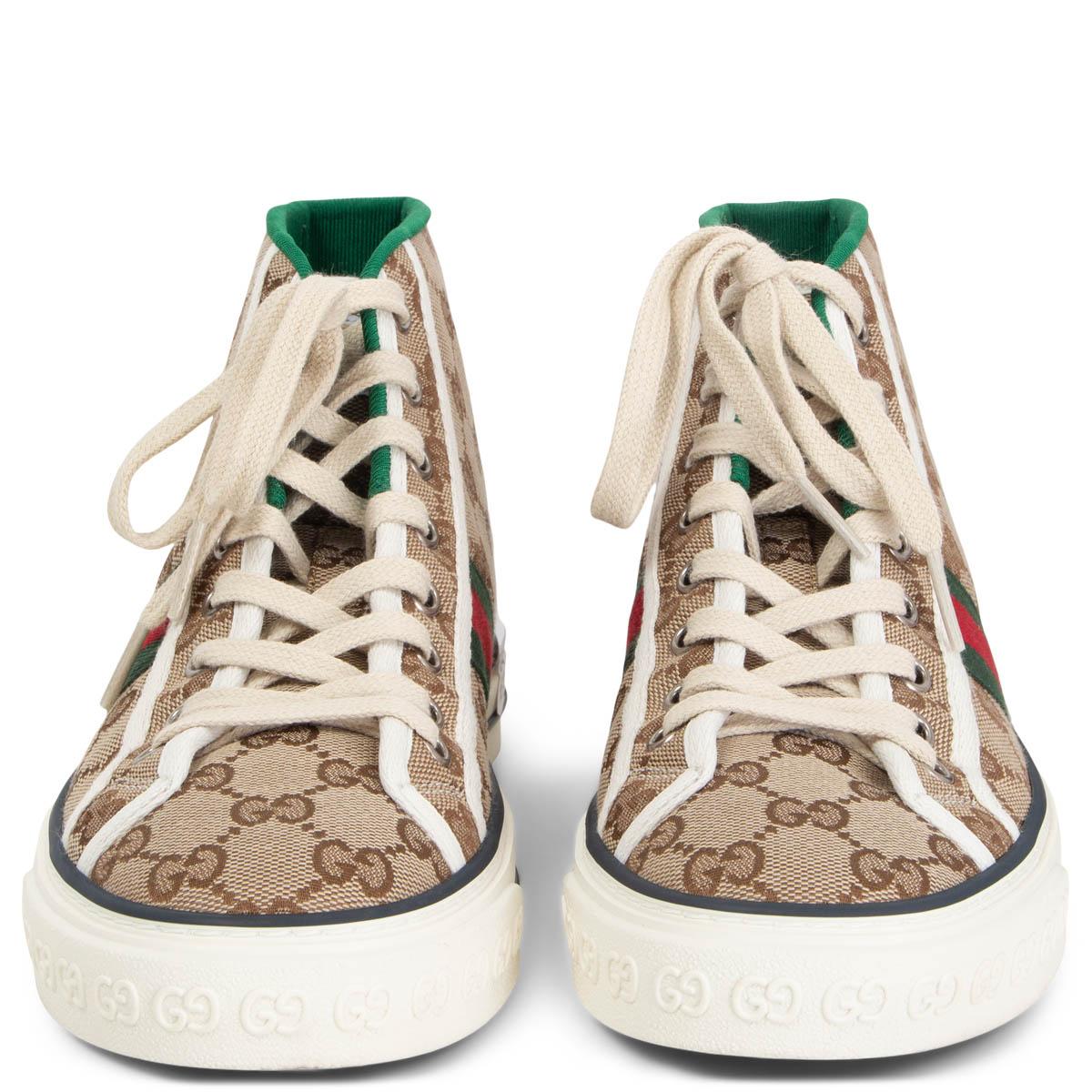 100% authentic Gucci Tennis 1977 high-top sneakers in beige and brown monogram canvas with the iconic red and green Web stripe on the side and white canvas trimming. GG motif at the sole. Have been worn once or twice and are in excellent condition.