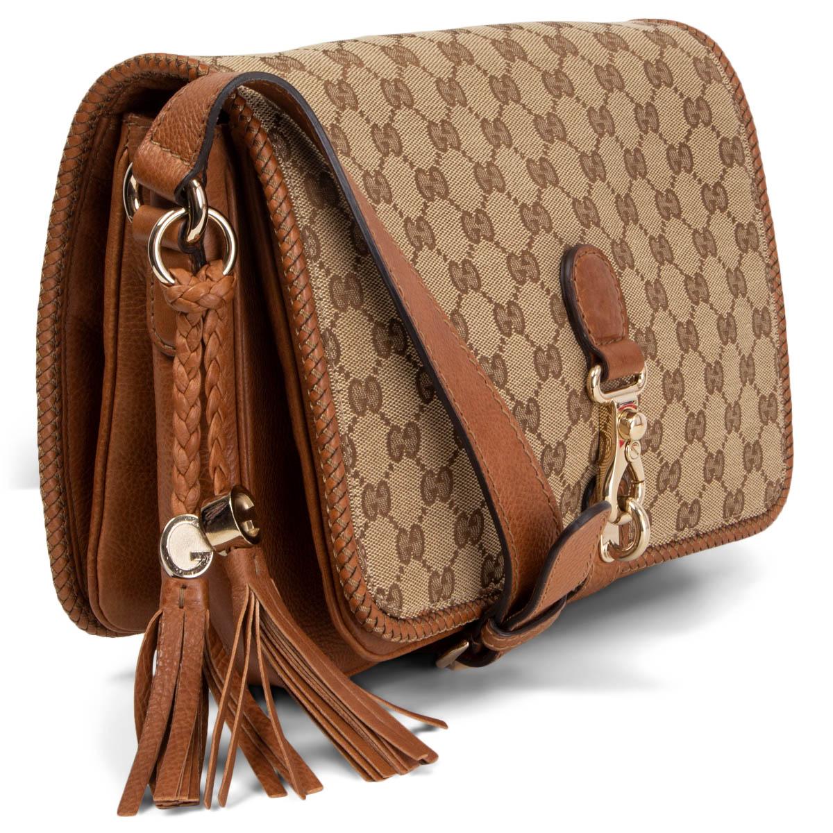 100% authentic Gucci Marrakech Medium Flap Messenger Bag in beige Monogram canvas and brown leather. It features an adjustable leather strap, tassels and light gold-tone hardware. This chic messenger opens with a lobster clasp lock closure and has