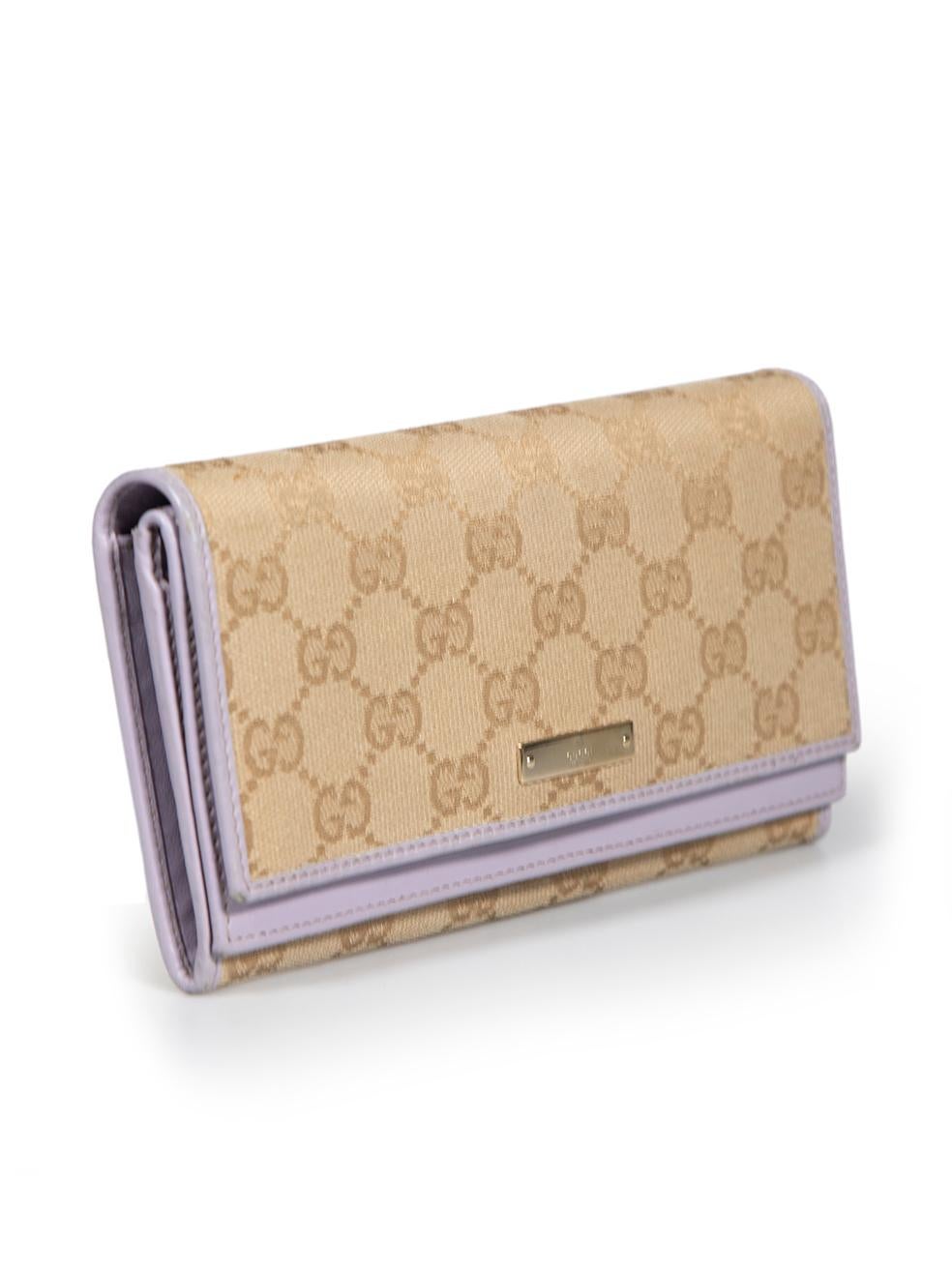 CONDITION is Very good. Minimal wear to wallet is evident. There is minimal wear to leather edge along wallet has some cracking on this used Gucci designer resale item.
 
 
 
 Details
 
 
 Beige
 
 Canvas
 
 Wallet
 
 Purple leather trim
 
 GG Logo