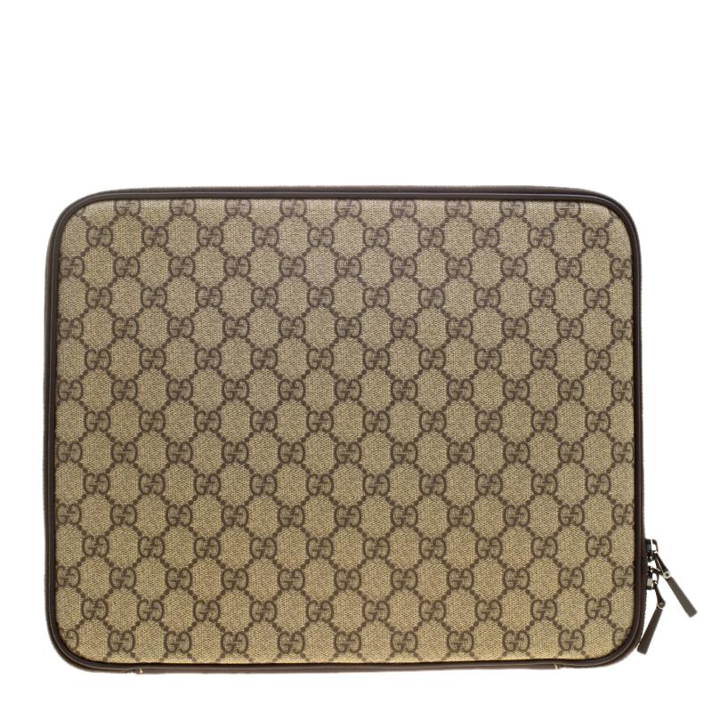Designed in a slim structure, this netbook case from Gucci is cut from canvas with interlocking GG motif on the front. It has a zip around closure that unfastens to reveal a fabric interior that will dutifully hold your netbook and keep it safe. Now