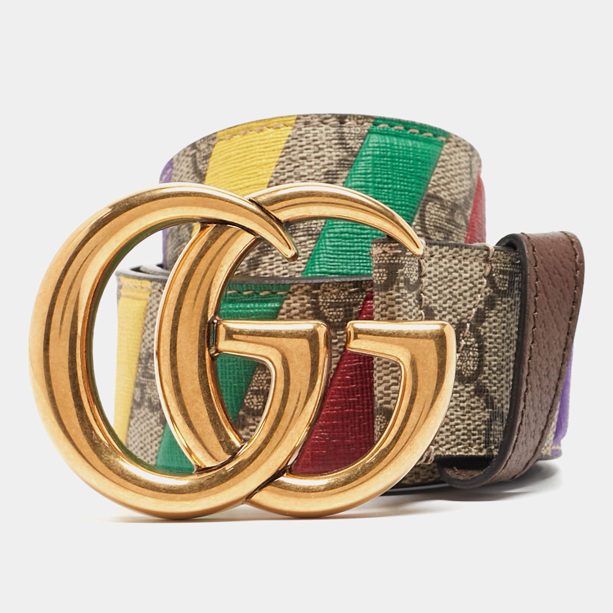 The Gucci belt epitomizes luxury with its iconic GG Supreme canvas adorned with a bold stripe and double G buckle. Crafted with meticulous attention to detail, it effortlessly combines sophistication, style, and timeless elegance for the discerning