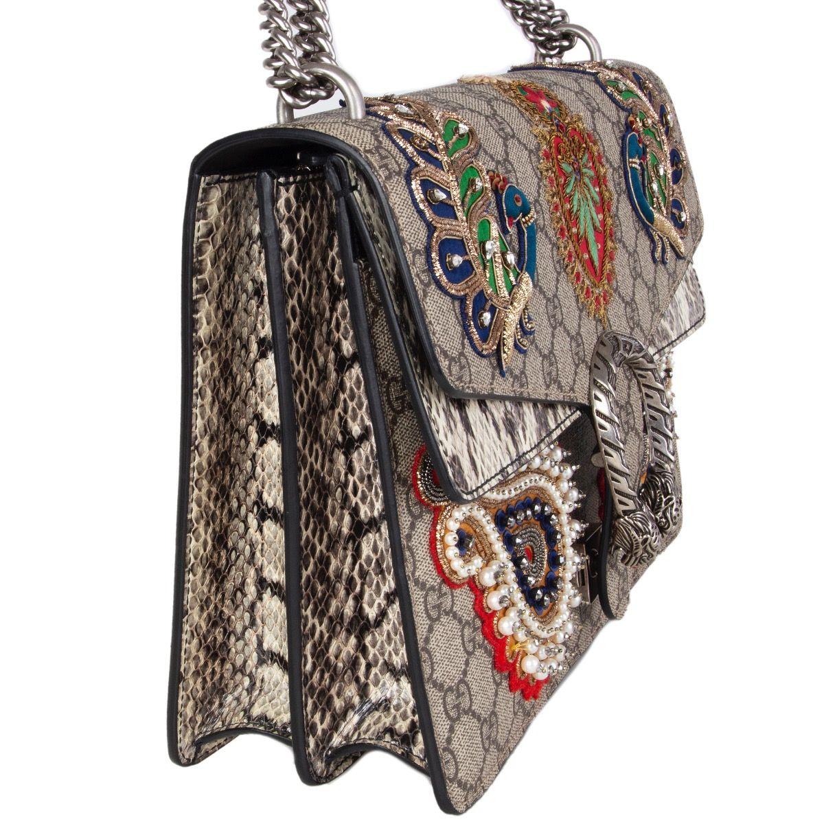 Gucci 'Dionysus GG Supreme' embellished shoulder bag featuring a foldover top with push-lock closure, with accordion details at sides. Peacock embroidery with metallic embellishments and rhinestones. Beaded paisly pearl embroidery. Snakeskin effect