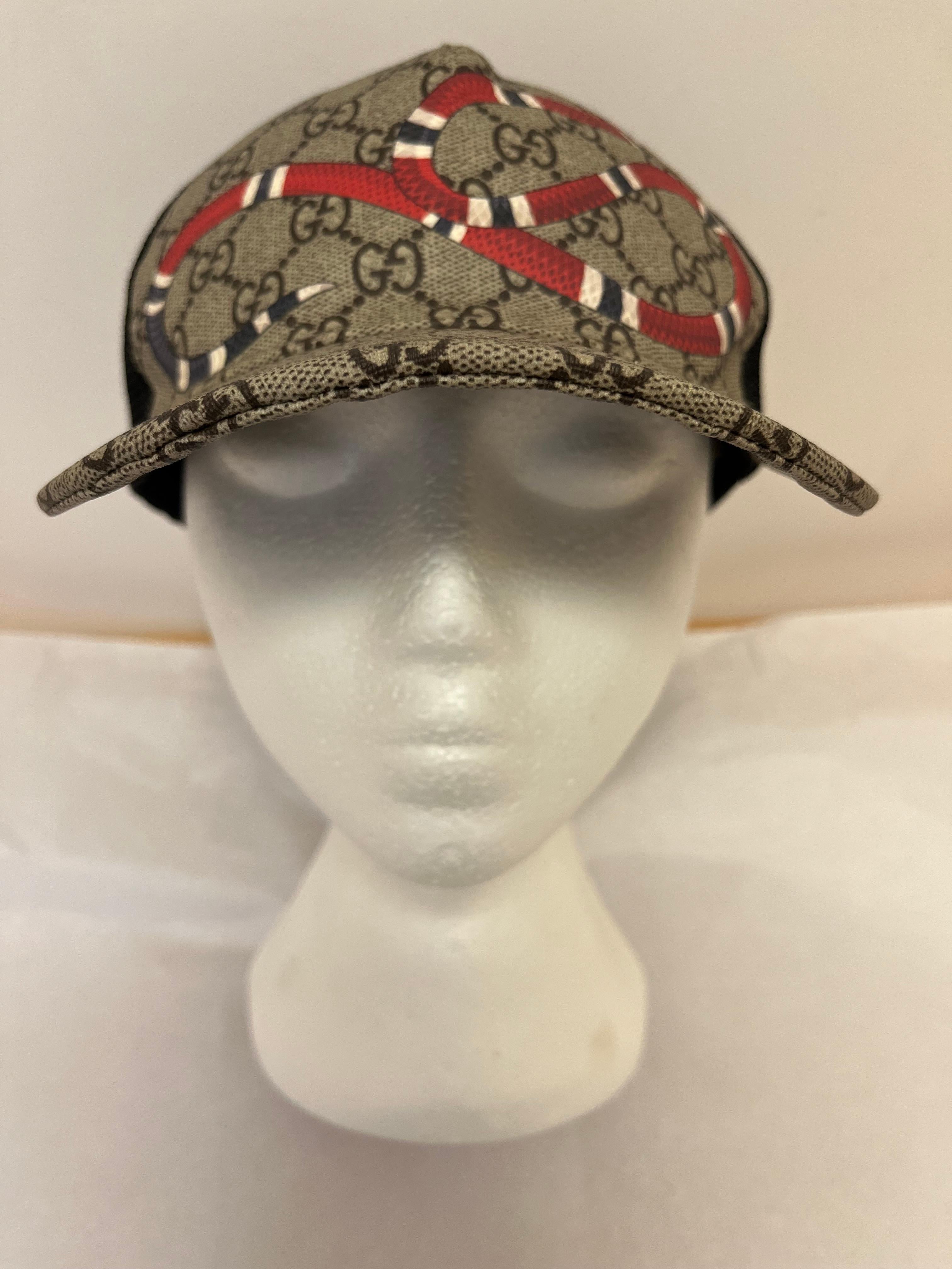 Any baseball fan would love this Gucci GG Monogram Supreme Kingsnake Baseball Cap. 
This baseball cap is made of 50% cotton and 50% viscose with the iconic Gucci GG monogram motif. 
The signature Kingsnake image is one of the many specialty caps