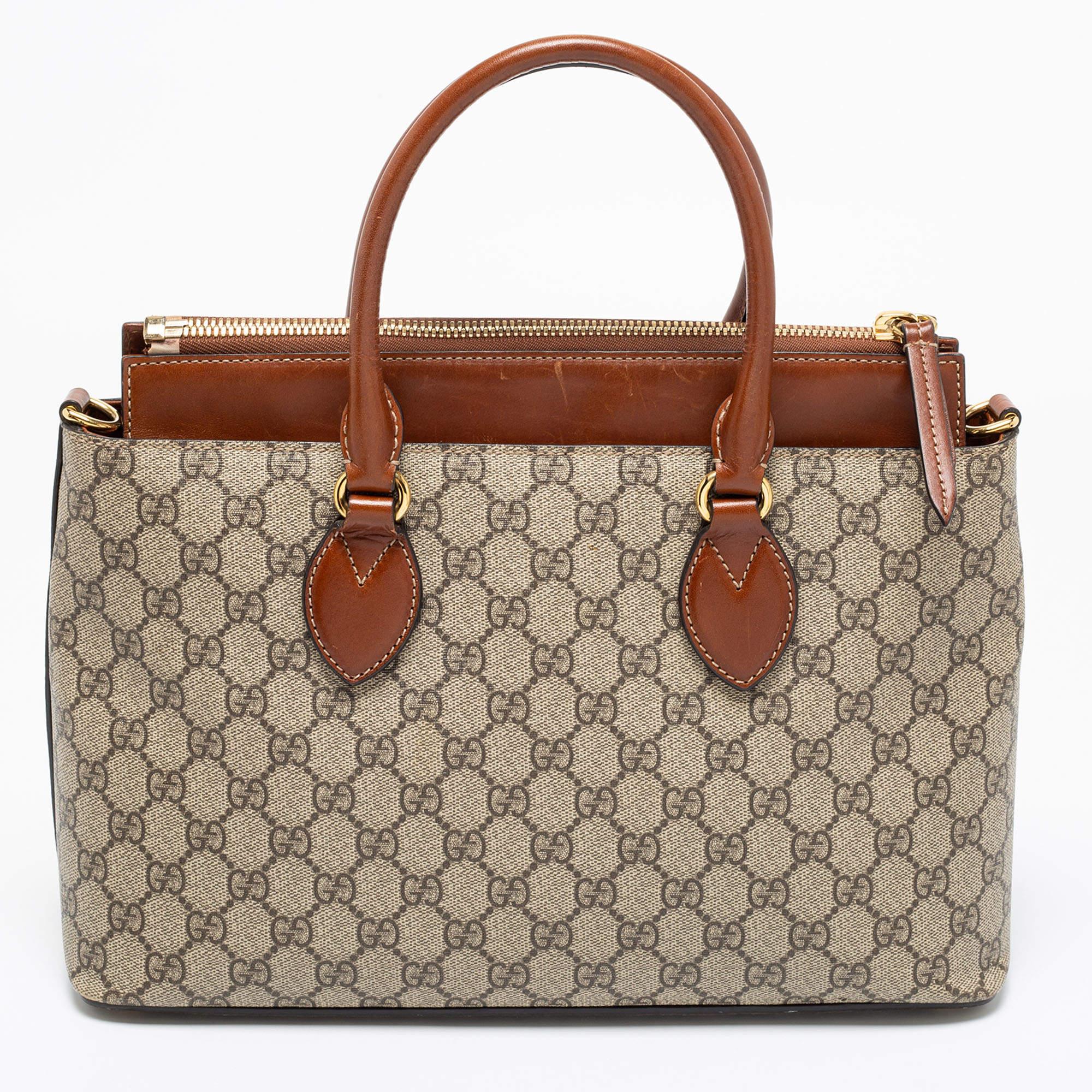 This Gucci tote strikes the perfect balance between fashion and function. Created from GG Supreme canvas, it is held by dual handles at the top and also features a shoulder strap, gold-tone hardware, and a spacious interior.

Includes: Original