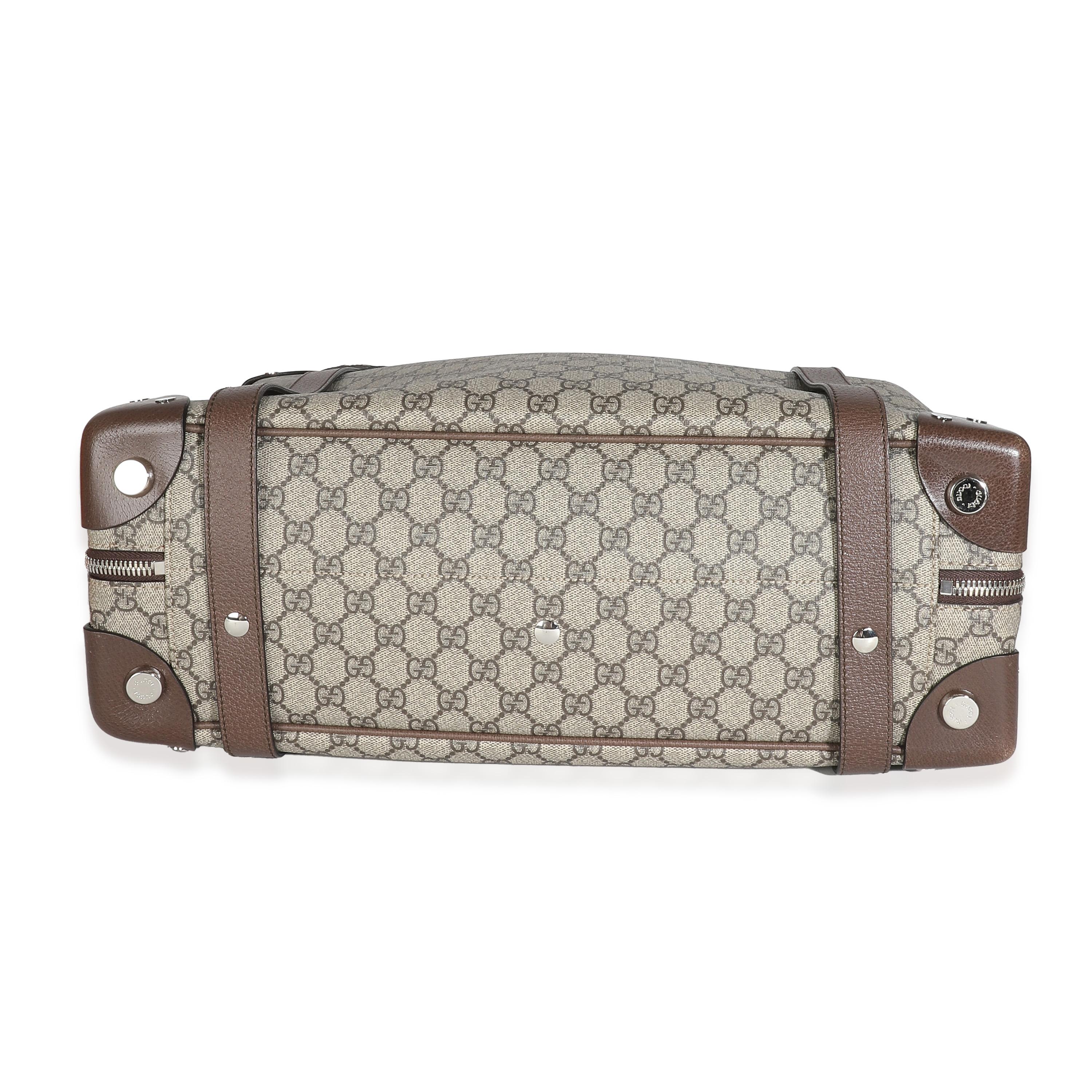 Listing Title: Gucci Beige GG Supreme Trunk Holdall Tote
SKU: 132857
Condition: Pre-owned 

Handbag Condition: Excellent
Condition Comments: Item is in excellent condition and displays light signs of wear. Mild scuffing and pilling along interior.