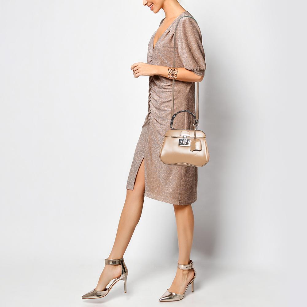 Designer bags are ideal companions for ample occasions! Here we have a fashion-meets-functionality piece crafted with precision. It has been equipped with a well-sized interior that can easily fit all your essentials.