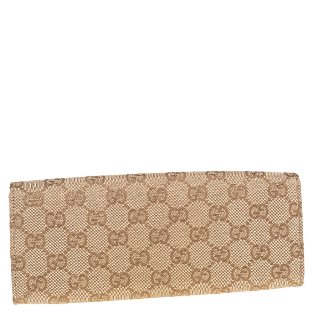A Gucci continental wallet is just what you need to own. It has been crafted from GG canvas as well as leather and styled with a front flap. It comes with a leather and fabric-lined interior that has multiple card slots and a main compartment for