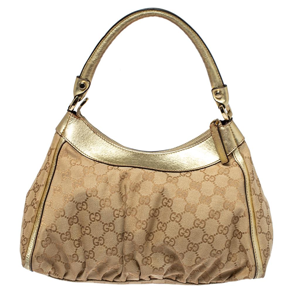Gucci brings to you this amazing D Ring hobo that is smart and modern. Made in Italy, this beige and gold hobo is crafted from classic GG canvas & leather and features a single top handle. The top zipper reveals a fabric-lined interior with enough