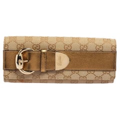 Gucci Beige/Gold GG Canvas Romy Clutch