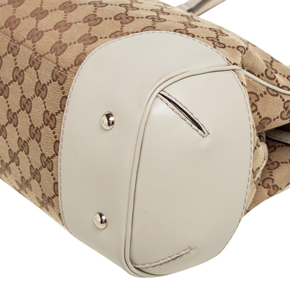 This Mayfair Bow bag by Gucci is perfect for everyday use. Crafted from signature GG canvas and leather, it has a classic silhouette. The tote has two handles, gold-tone hardware, a canvas-lined interior, and the signature Web detail with bow on the