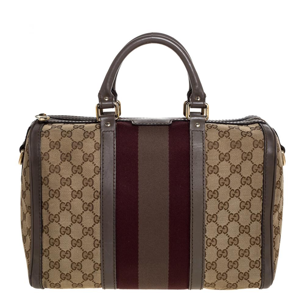 A truly posh and elegant piece to add to your collection. This Web Boston bag by Gucci is crafted from GG canvas & leather and styled with their signature web accent. It features a top zip closure, two leather handles, and a spacious canvas interior