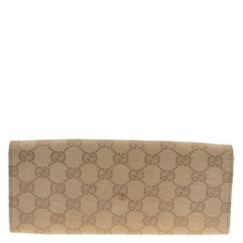 The legacy of Guccio Gucci continues with stylish products from the label such as this wallet. It features the iconic Guccisima canvas and is accented with a gold buckle and leather trim. Its magnetic snap closure opens to a lined interior with one