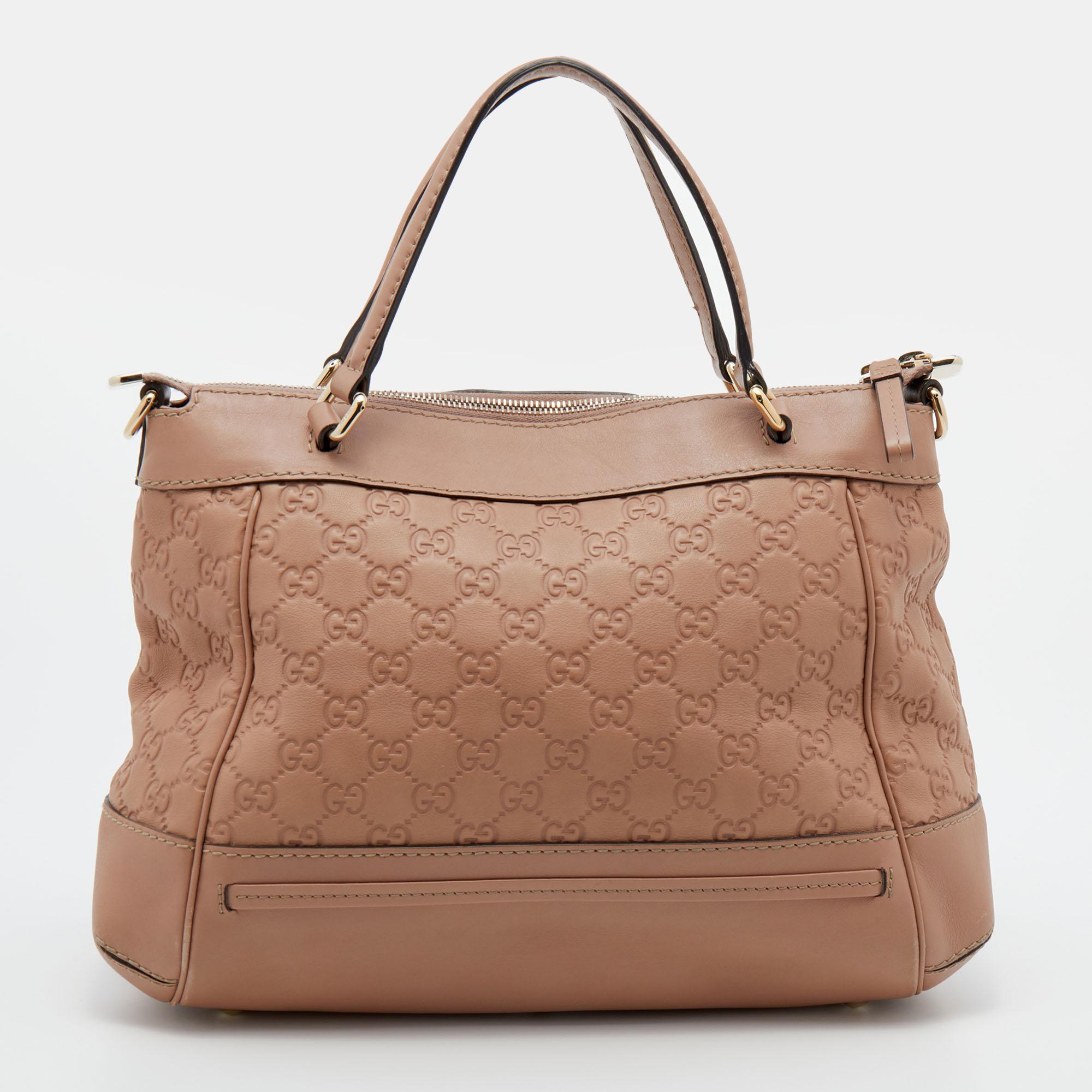 This designer tote from the House of Gucci is super classy and functional, perfect for everyday use. It is made from Guccissima leather on the exterior with a bow accent adorning the front. It has two handles and a bag strap.

Includes: Original