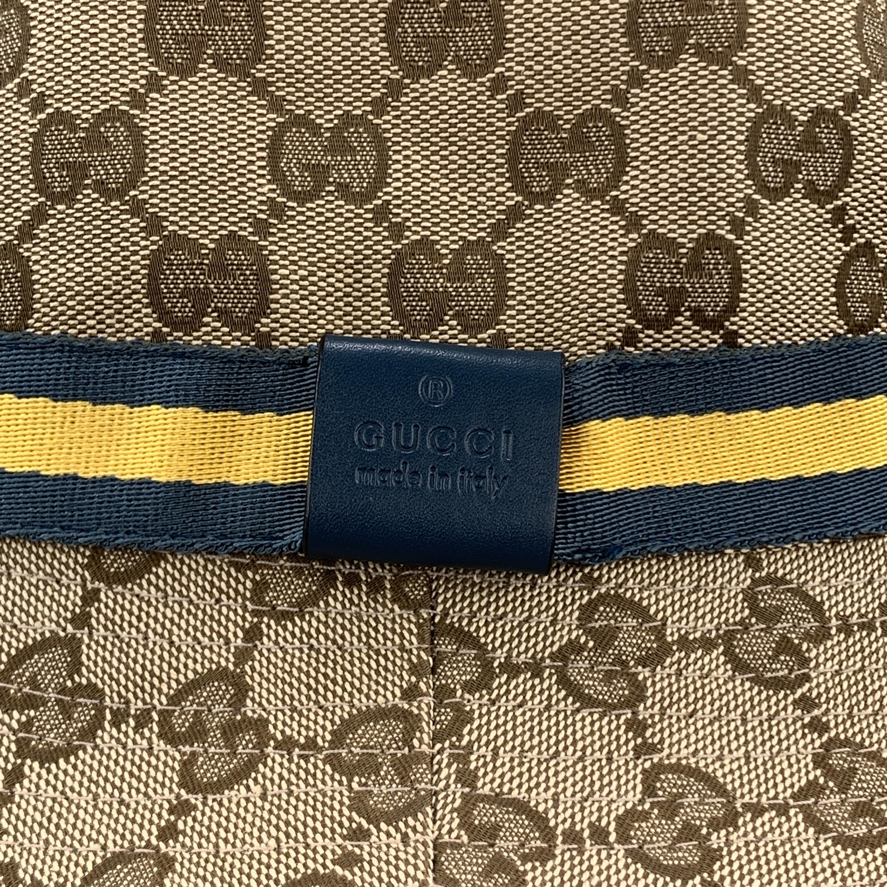 Vintage GUCCI bucket hat comes in classic beige Guccissima monogram canvas with a teal blue and yellow ribbon stripe and leather Logo embossed label. Made in Italy.

Excellent Pre-Owned Condition.
Marked: L

Measurements:

Opening: 22 in.
Brim: 2