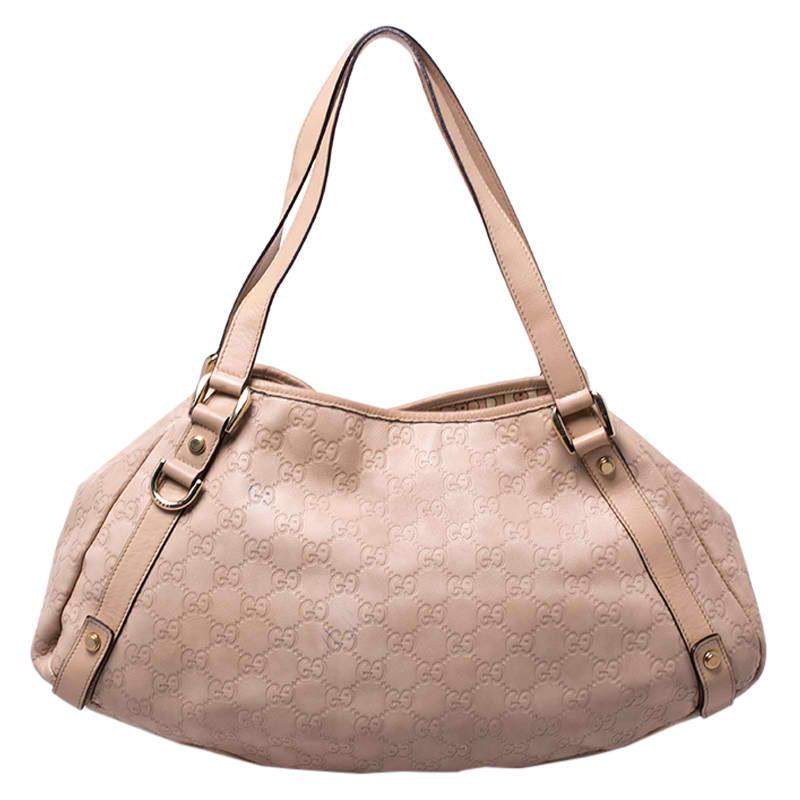 This Gucci Abbey hobo is a classic that will last for years to come. Made from beige leather the exterior is accented with gold-tone D-rings, and top handles. The bag is lined with fabric and will hold your essentials with ease.

Includes: The