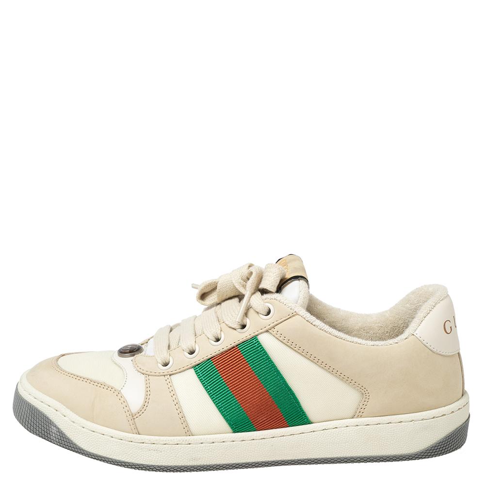 This pair of Gucci Screener sneakers has been treated for a vintage-like, distressed effect. The sneakers feature the famous Web trim, the iconic GG logo, and lace-up vamps. The low-top shoe is made in Italy.

Includes: Original Box, Info Booklet,