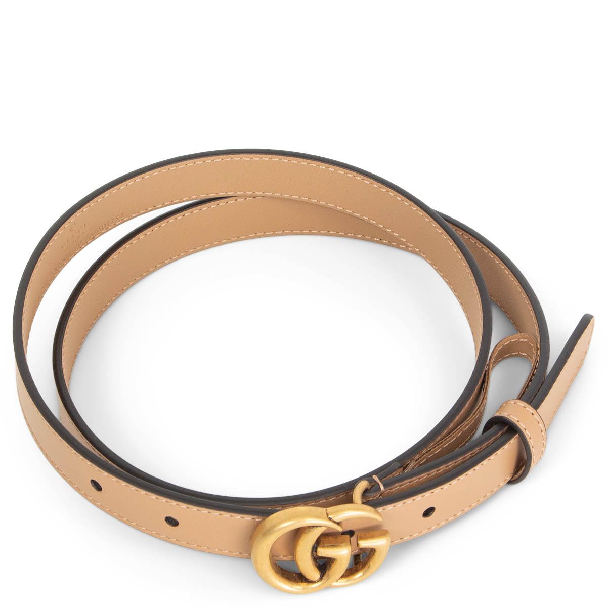 100% authentic Gucci GG Marmont Thin Belt in beige leather and featuring and antique gold-tone metal buckle. Brand new. Comes with dust bag. 

Measurements
Tag Size	90
Width	2cm (0.8in)
Fits	85cm (33.2in) to 95cm (37.1in)
Length	105cm (41in)
Buckle
