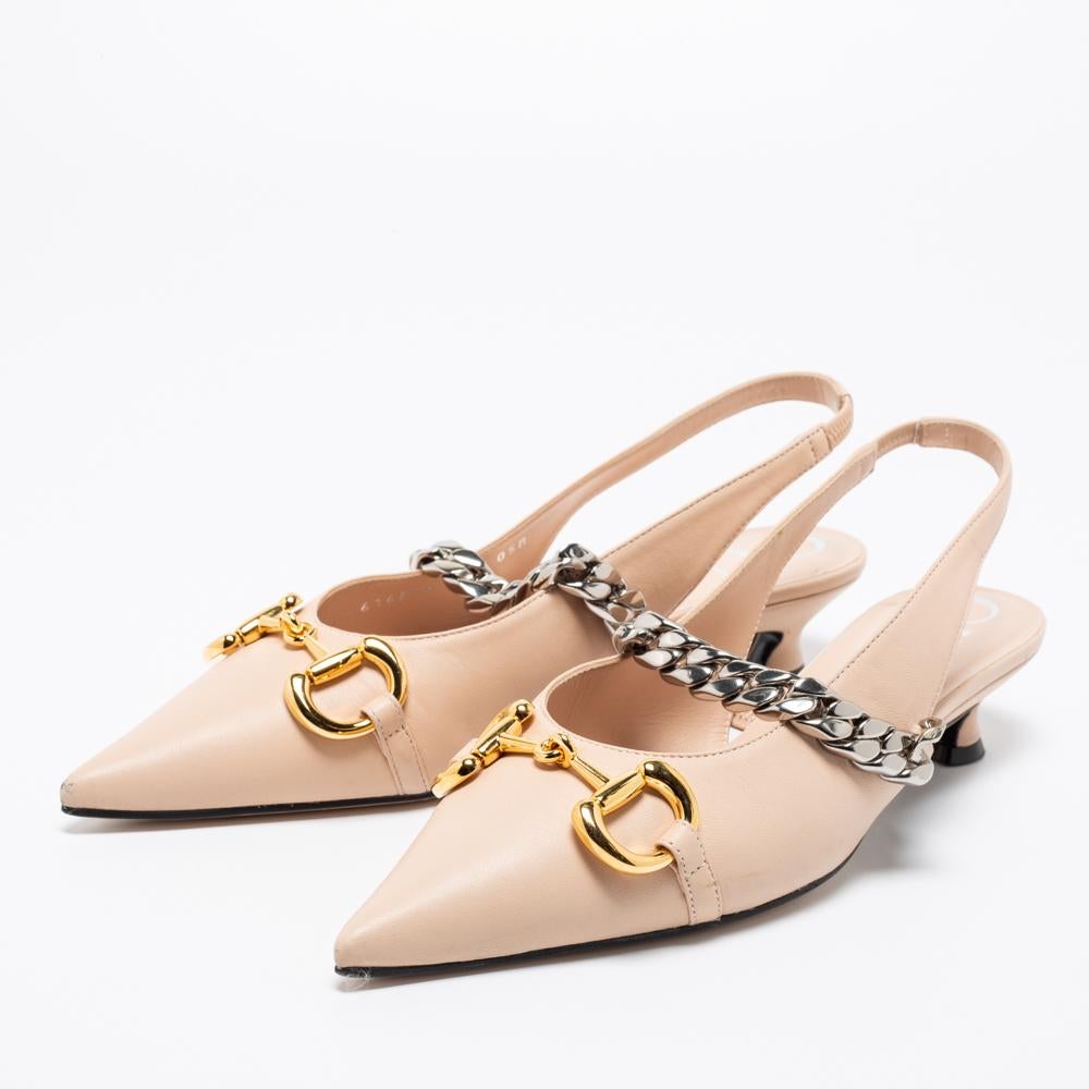 Simply luxe, these sandals from Gucci will help you stay comfortable throughout the day! The beige sandals are crafted from leather and designed with pointed toes and slingbacks. They flaunt chain & Horsebit detailing on the uppers and come equipped