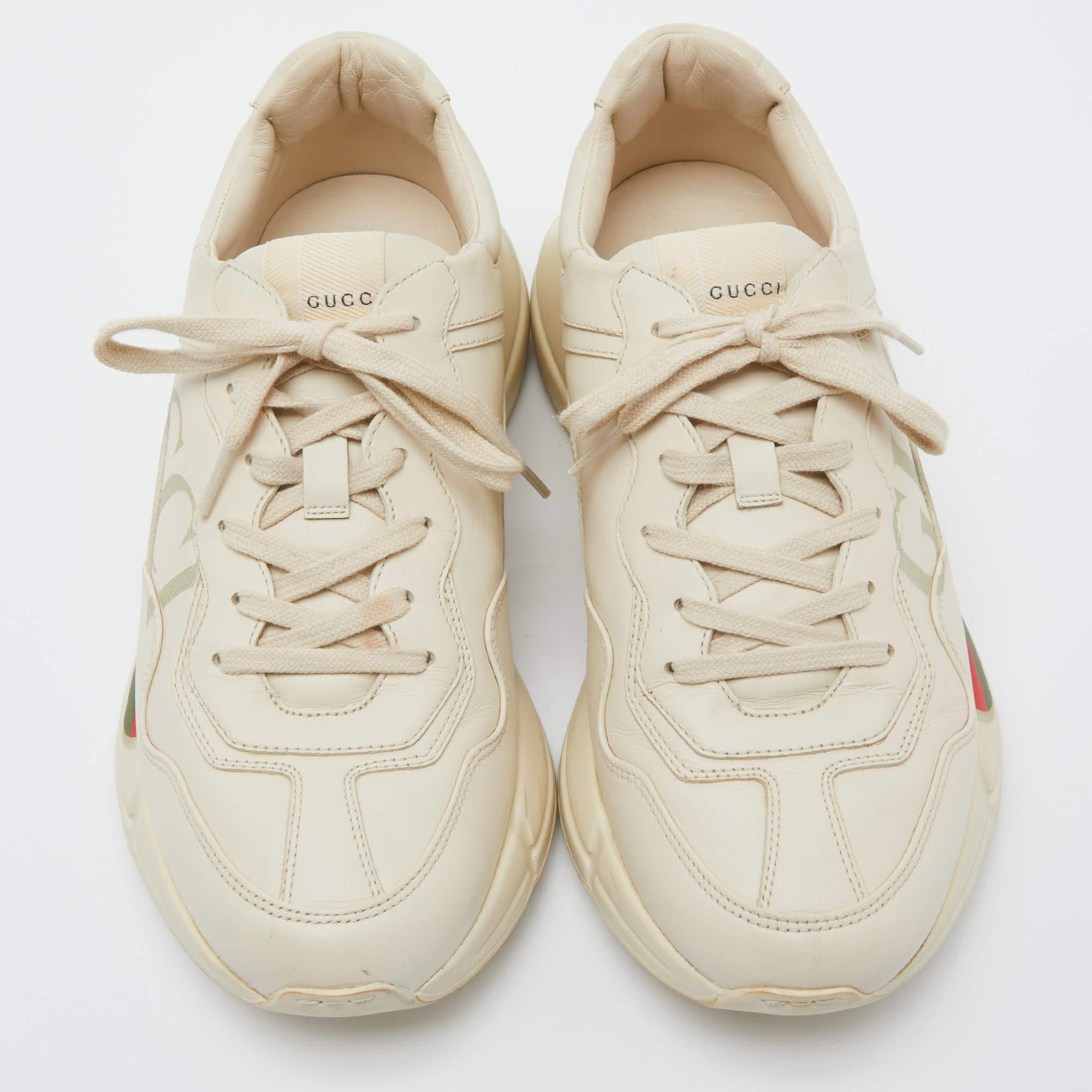 The time to feel trendy is now as Gucci brings you these superhit sneakers in beige. They are crafted from leather, detailed with lace-ups, signature elements, and are set on highly comfortable soles. You are sure to receive nods of approval when